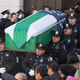 Pallbearers carry the casket of Officer Rafael Ramos of the New York City Police Department out of Christ Tabernacle Church on Dec. 27, 2014, in Queens, N.Y. Ramos and Officer Wenjian Liu were attacked without warning and fatally shot as they sat in a marked police car in Brooklyn on Dec. 20.
Kevin Hagen/Getty Images